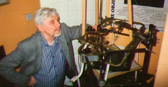 Dr Desmond Henry at one of his drawing machines